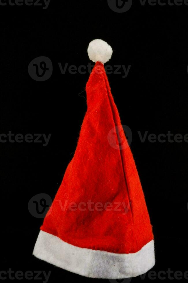 Santa hat on black background photo