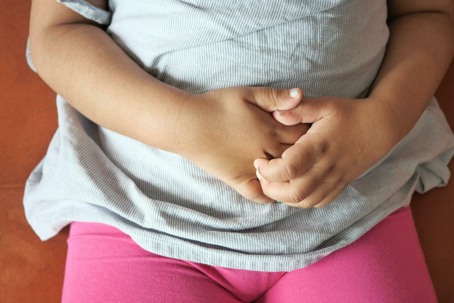 child girl suffering from itching skin on hand close up. photo