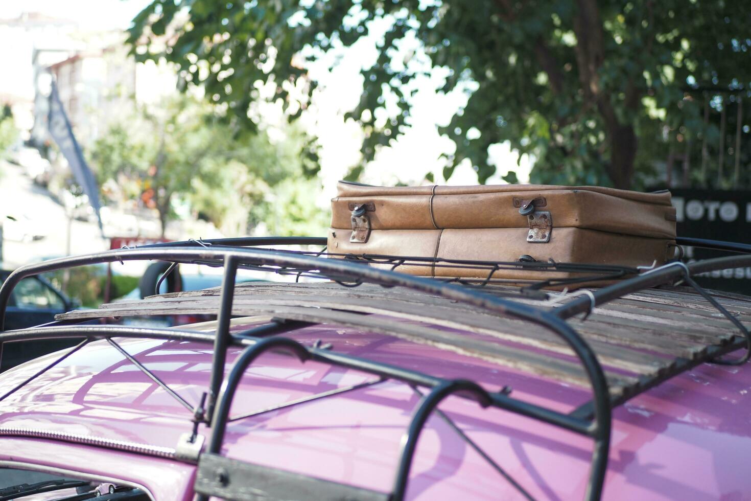 retro car with luggage on the roof . photo