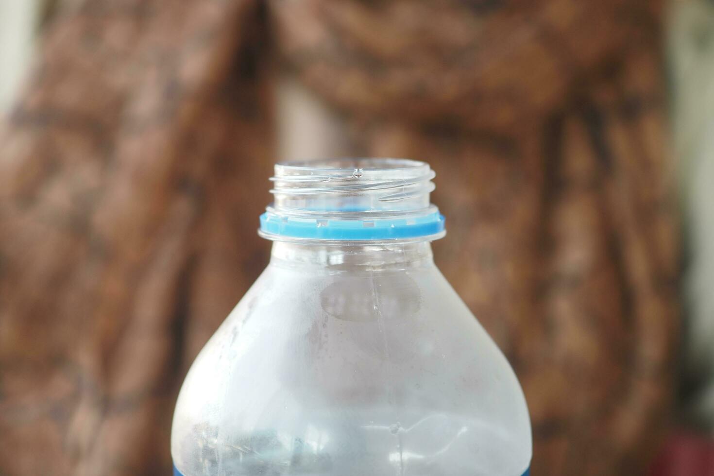 open a cap of a plastic water bottle photo