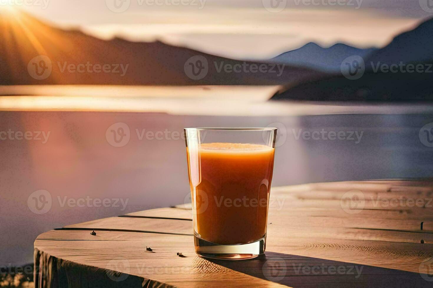 a glass of orange juice on a table in front of a lake. AI-Generated photo