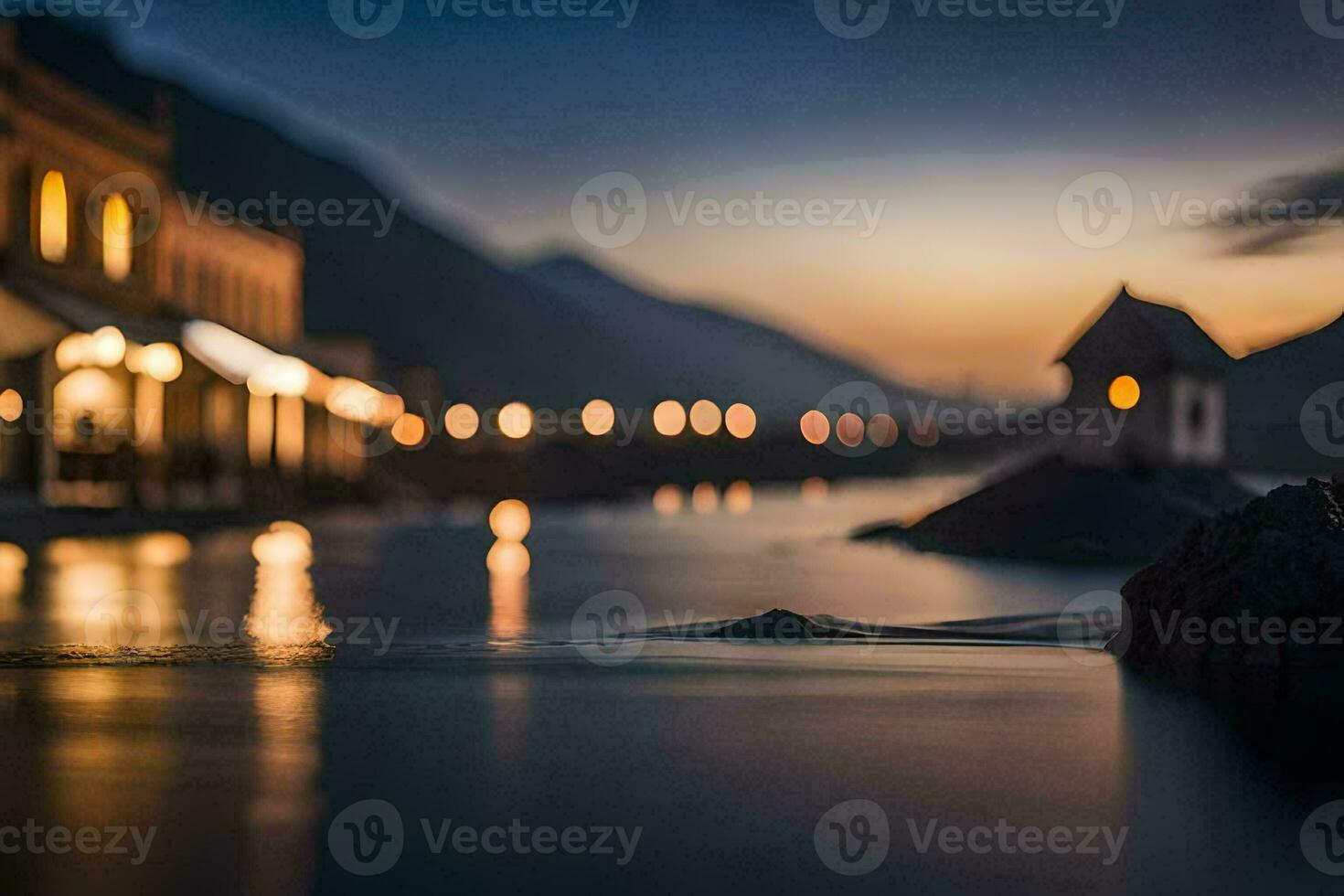 a lake at dusk with lights on the buildings. AI-Generated photo