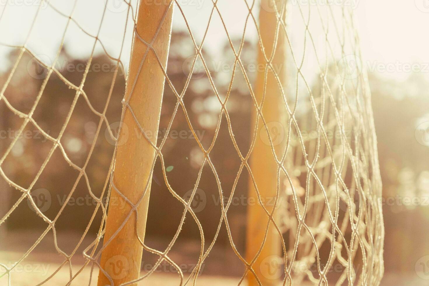 soccer goal on a sandy beach near the sea photo