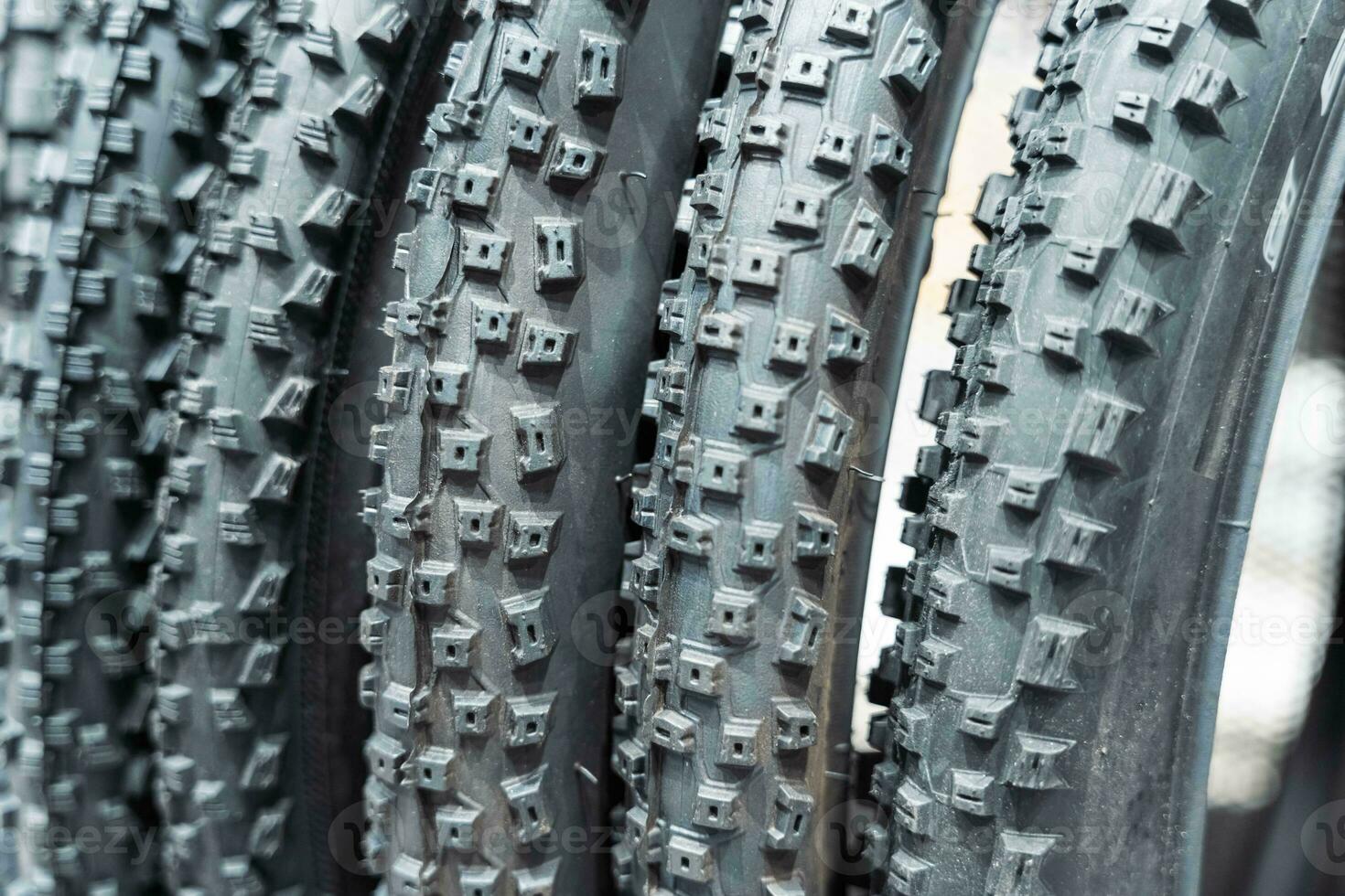 number of new bicycle tires for a mountain bike on a shelf in a sports store photo