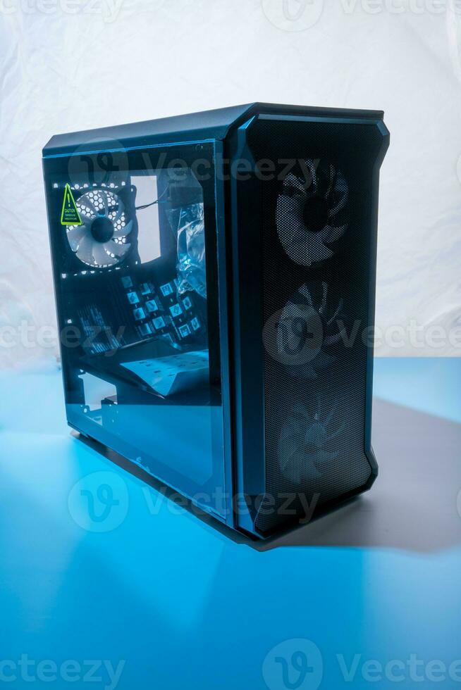 case of the computer system unit with neon illumination. vertical photo