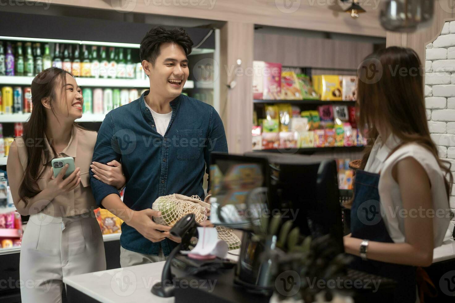 An Asian couple shopping in supermarket , concept of city life lifestyle photo