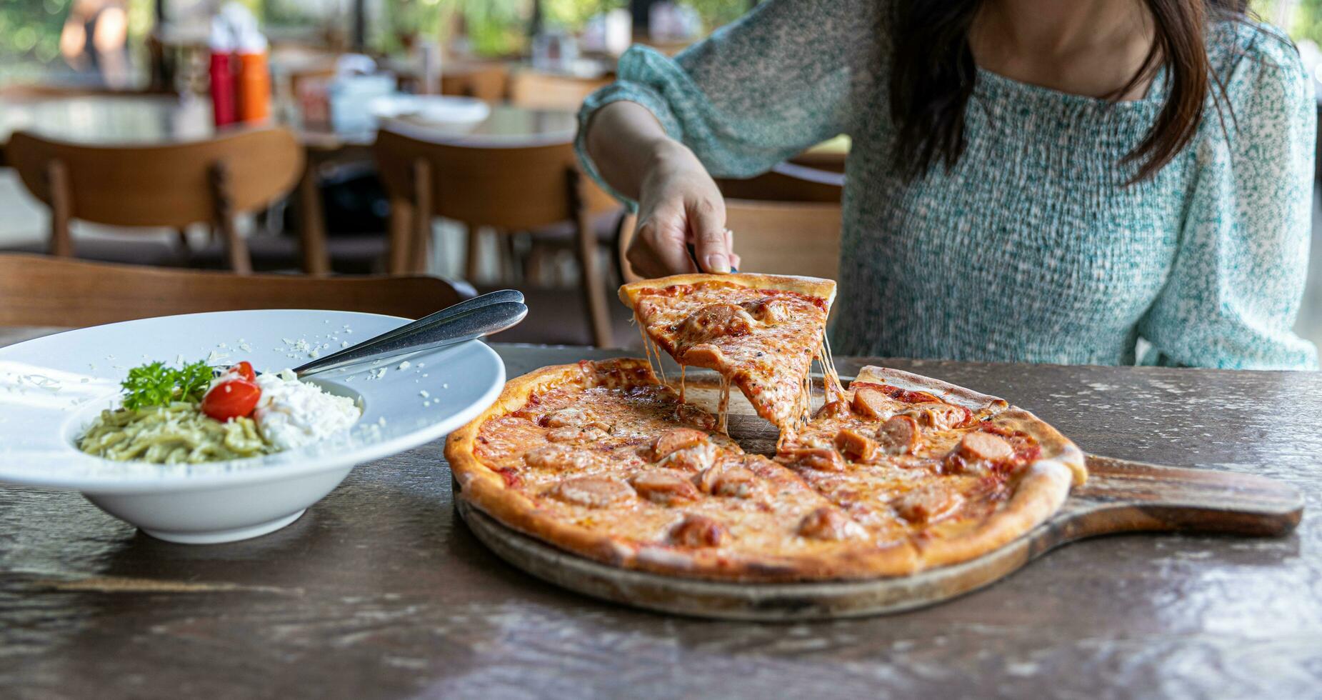 Pepperoni Pizza with Mozzarella cheese, salami, Tomatoes, pepper, Spices and Fresh Basil. Italian pizza. Pizza slice on wood dish. originality photo
