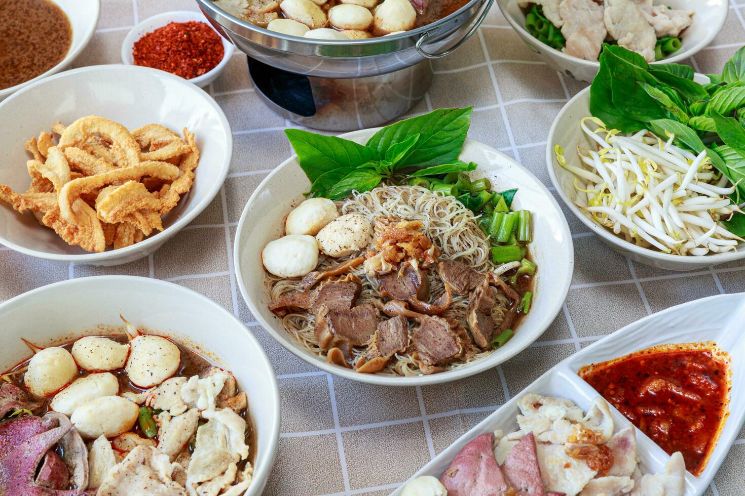 Thai boat noodles with Thai spices and ingredient on background. photo