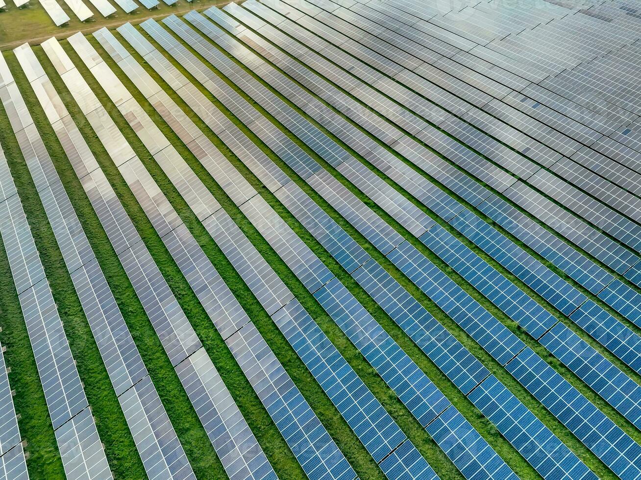 Aerial view of solar farm. Solar power for green energy. Sustainable resources. Solar cell panels use sun light as a source to generate electricity. Photovoltaics or PV. Sustainable renewable energy. photo