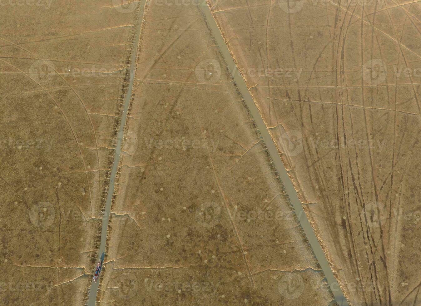 Aerial drone view of coastal mudflat. Natural blue carbon sink and carbon capture. Nature landscape. Coastal environment. Mud sea beach. Aquaculture farming. Shellfish farm. Eco-friendly conservation. photo