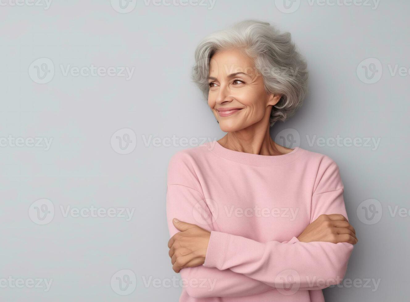 A smiling senior woman standing with arms crossed. AI Generated photo