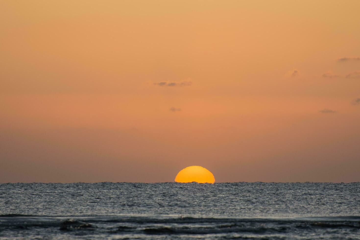 amazing warm sunrise at the red sea during vacation in the spring detail photo