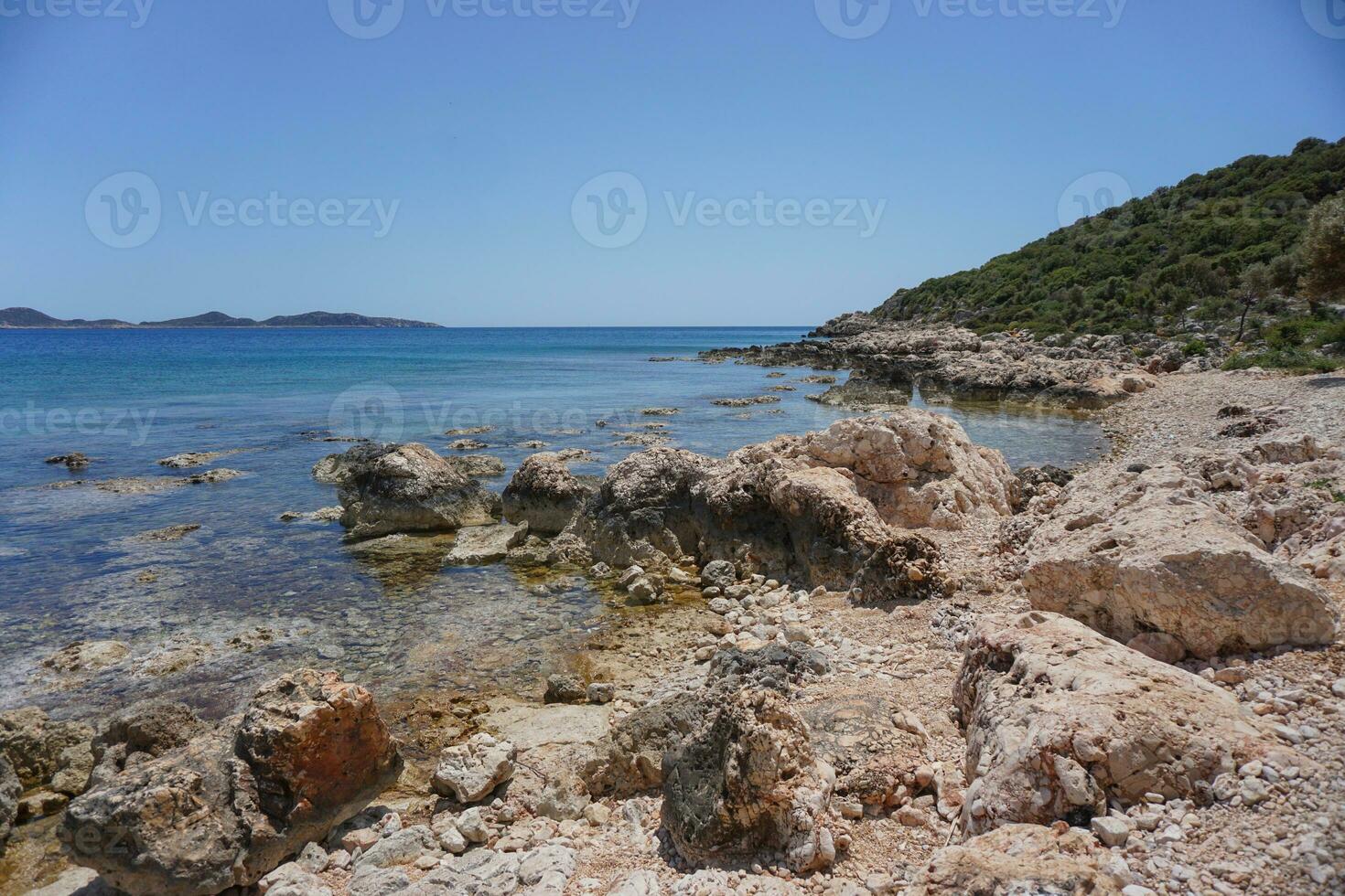 The coast of the sea with beautiful blue clear water photo