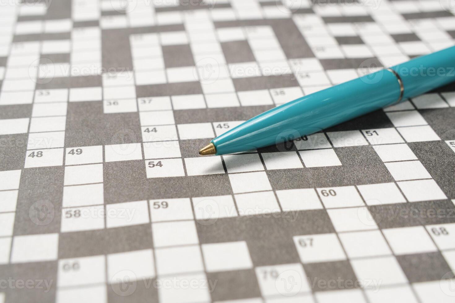 Ballpoint pen is lying crossword puzzle sheet. 33947551 Stock Photo at