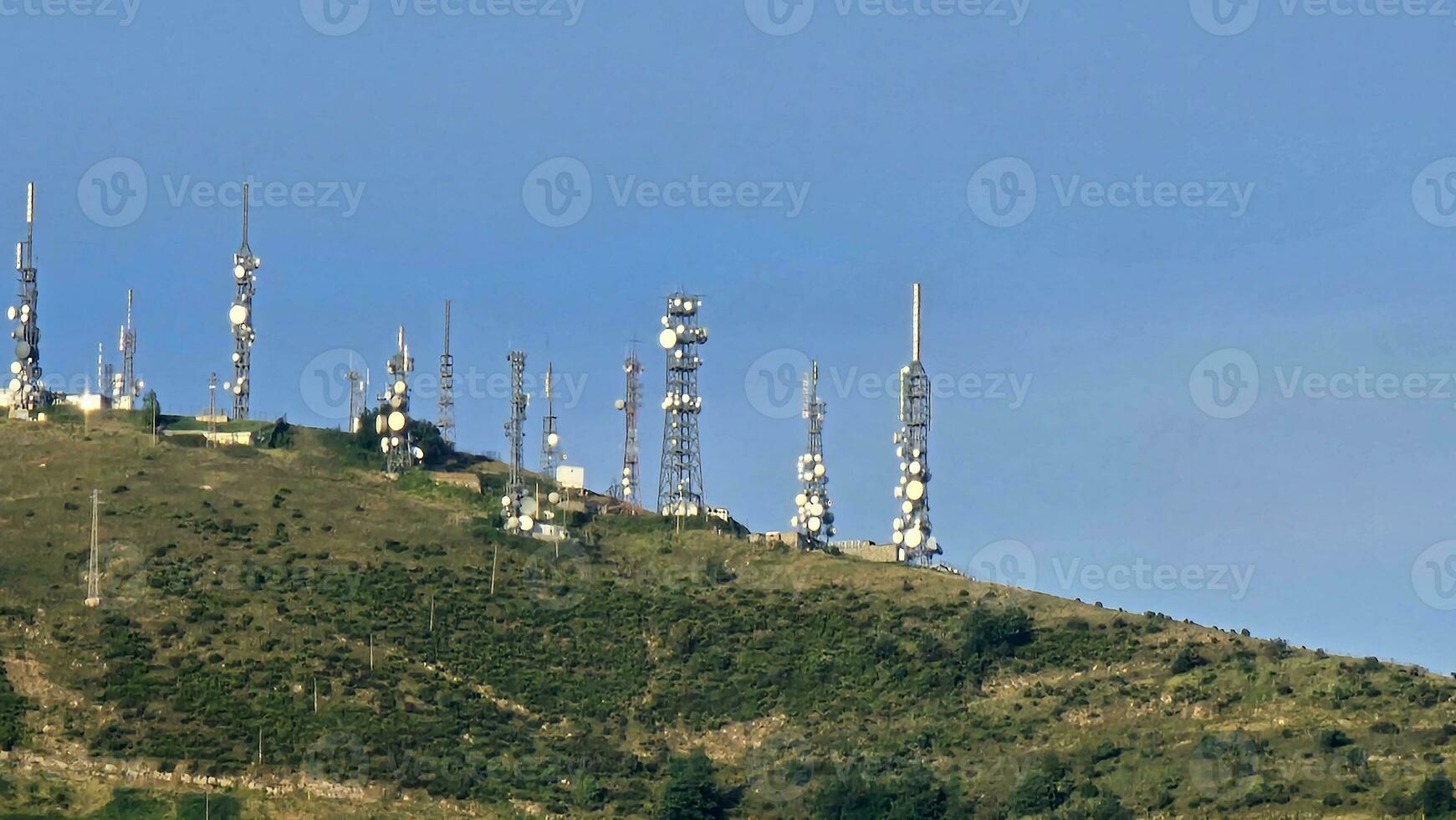 television and telephone antennas and repeaters that deal with telecommunications, on the Ligurian coast of Genoa in the autumn of 2023 photo