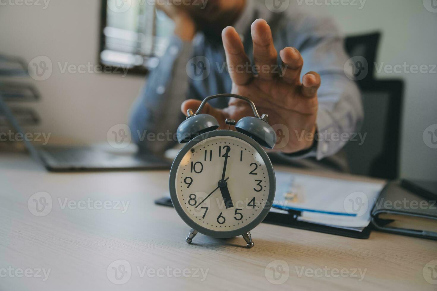 Business working times concept people work typing on laptop computer overlay with in time clock to lunch break photo