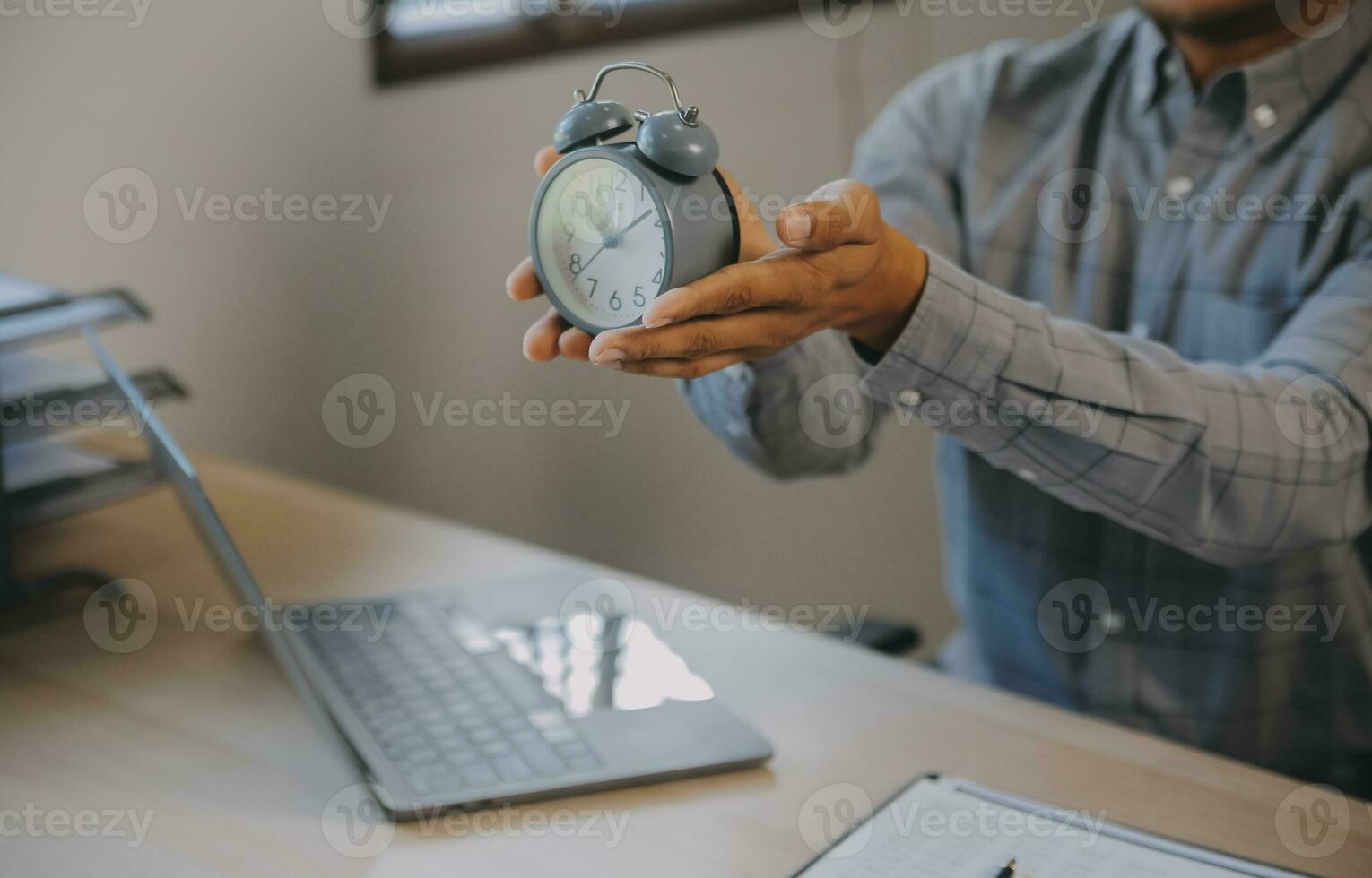 Business working times concept people work typing on laptop computer overlay with in time clock to lunch break photo