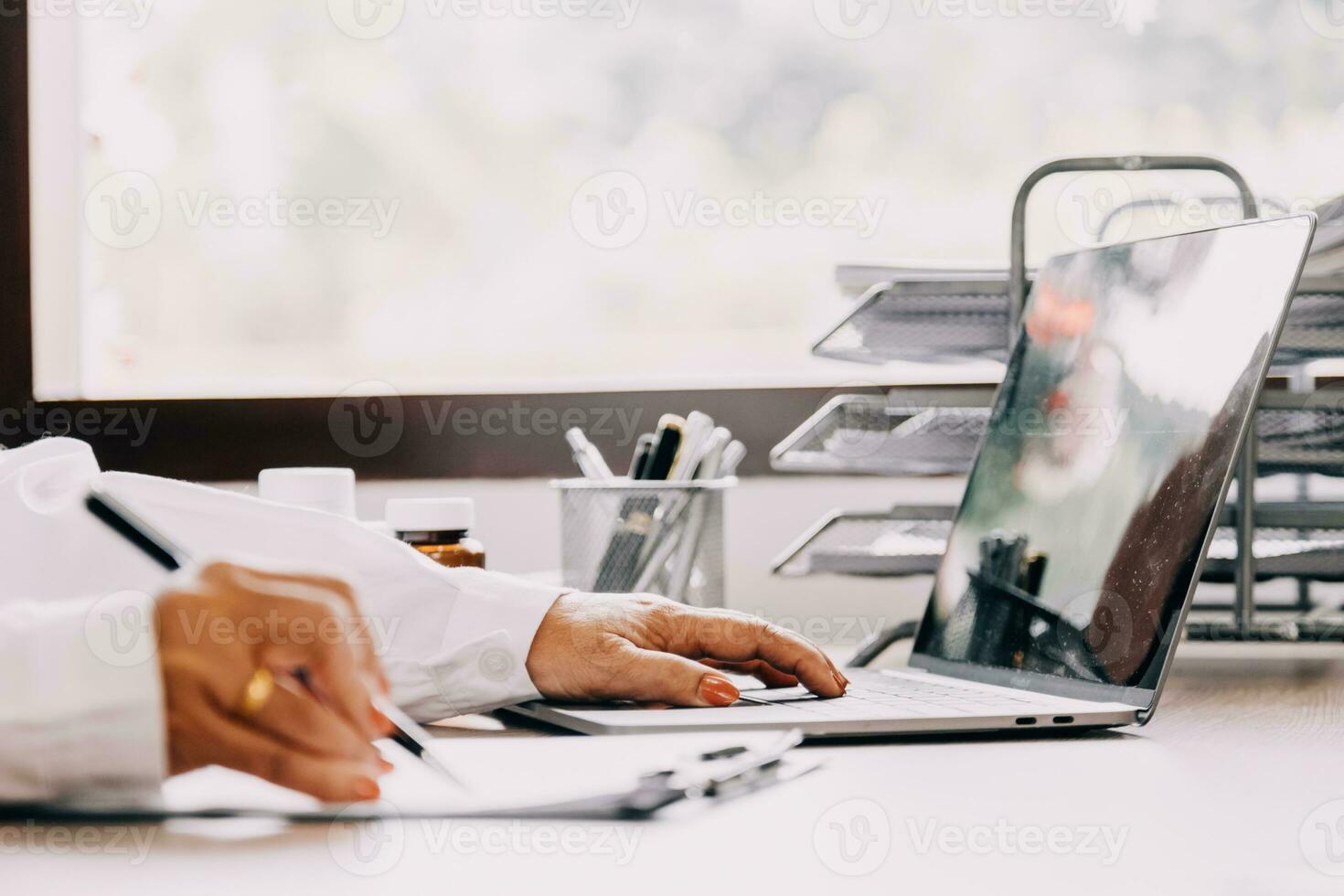 Online training. Young Latin American girl student doctor studies online at home from laptop photo