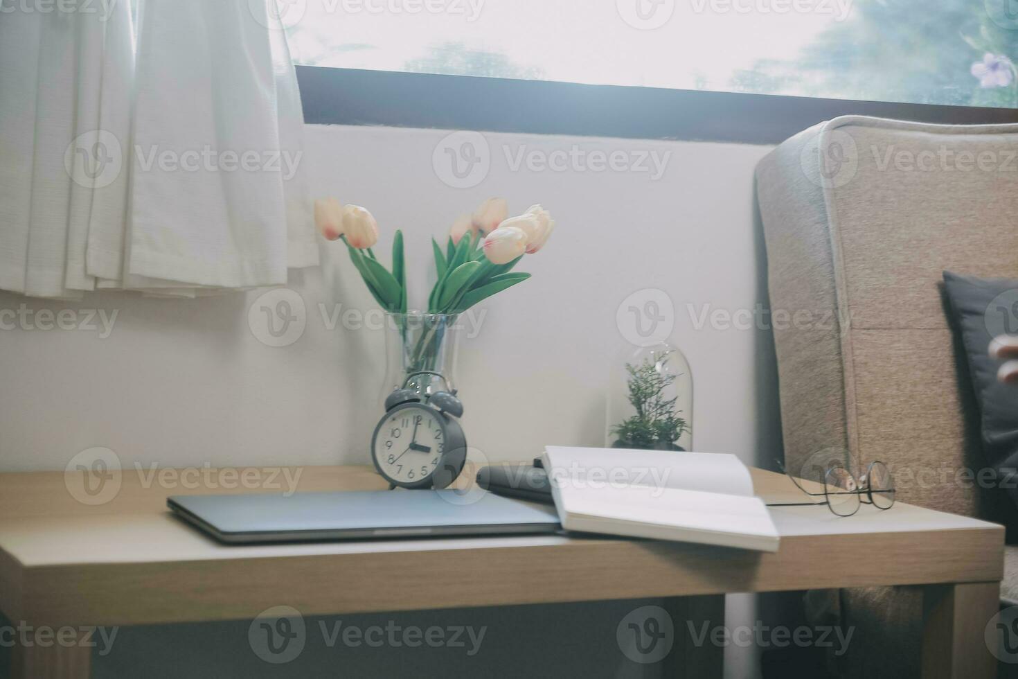 Alone man silhouette staring at the window closed with curtains in bedroom. Man stands at window alone photo
