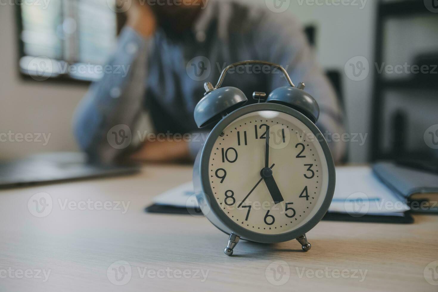 Business working times concept people work typing on laptop computer overlay with in time clock to lunch break photo