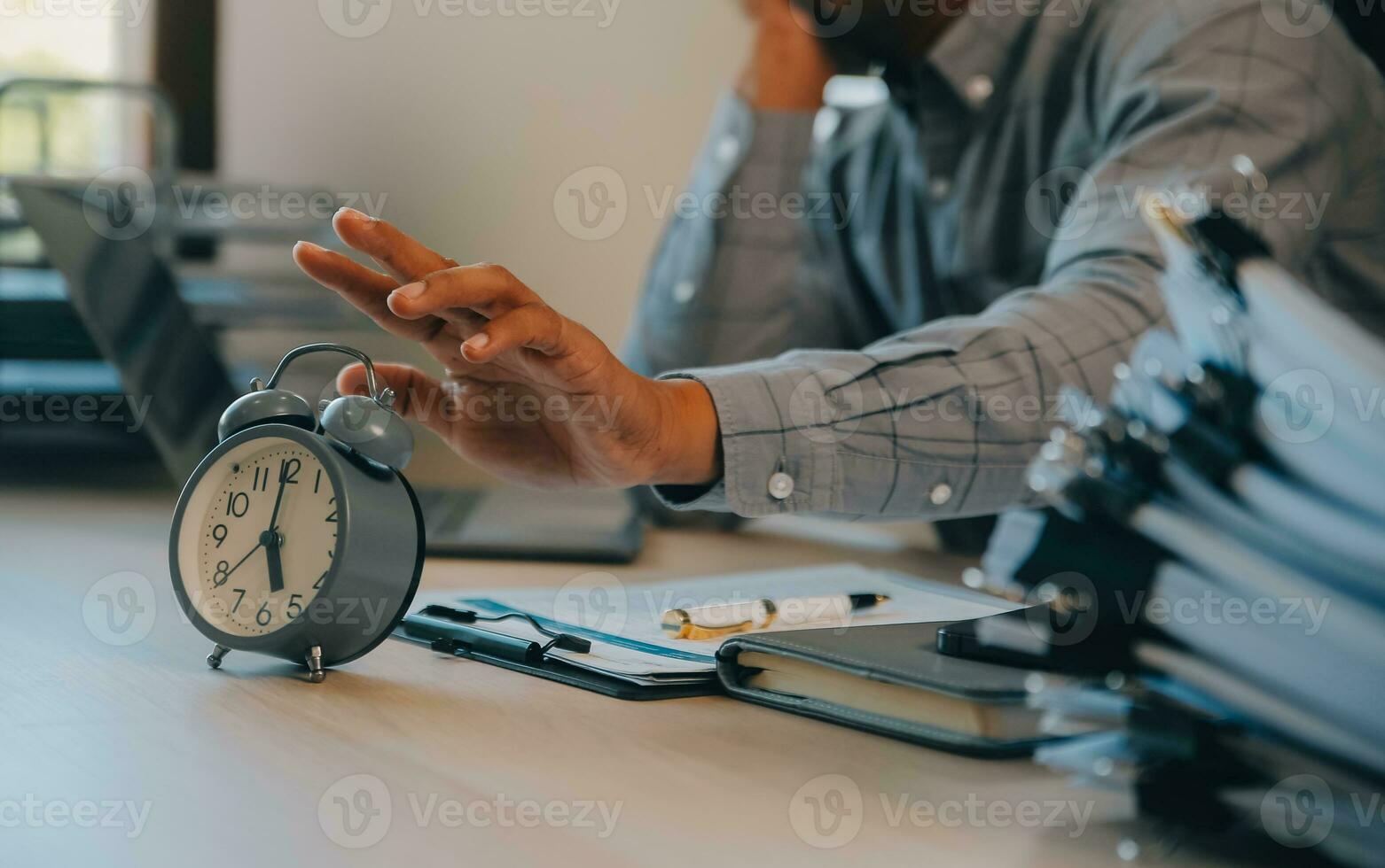 Business working times concept people work typing on laptop computer overlay with in time clock to lunch break photo