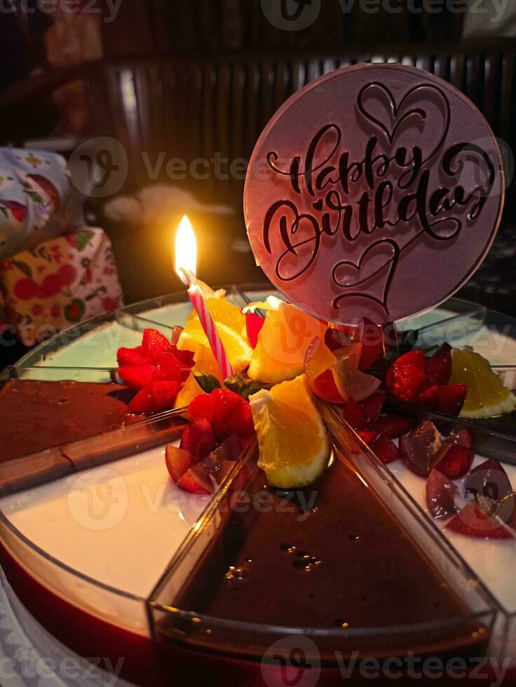 Birthday pudding with candle photo