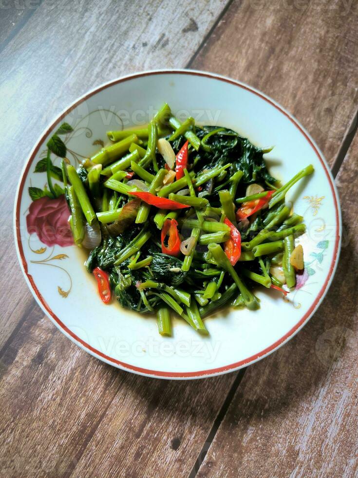 A plate of chilli spinach stir fry photo