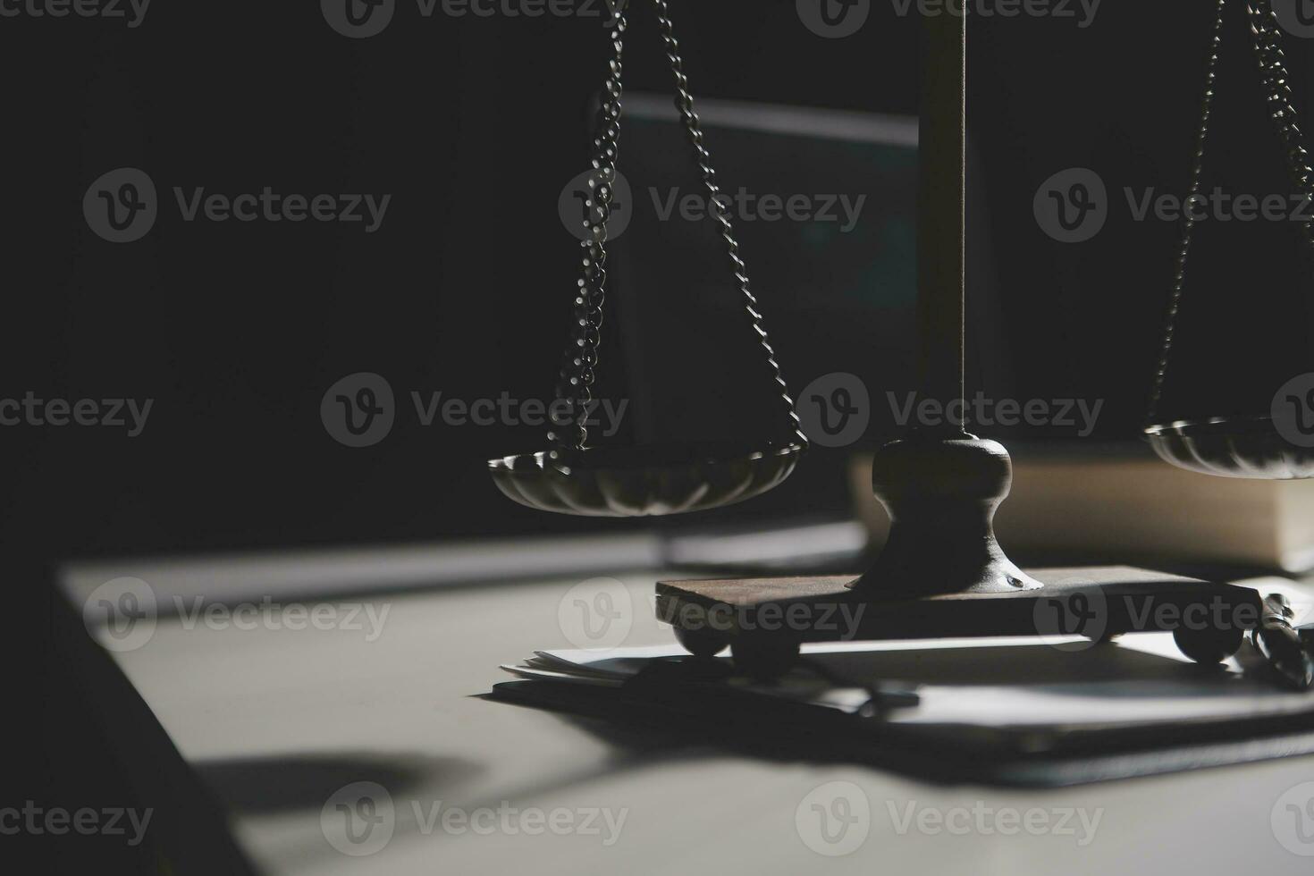 Business and lawyers discussing contract papers with brass scale on desk in office. Law, legal services, advice, justice and law concept picture with film grain effect photo