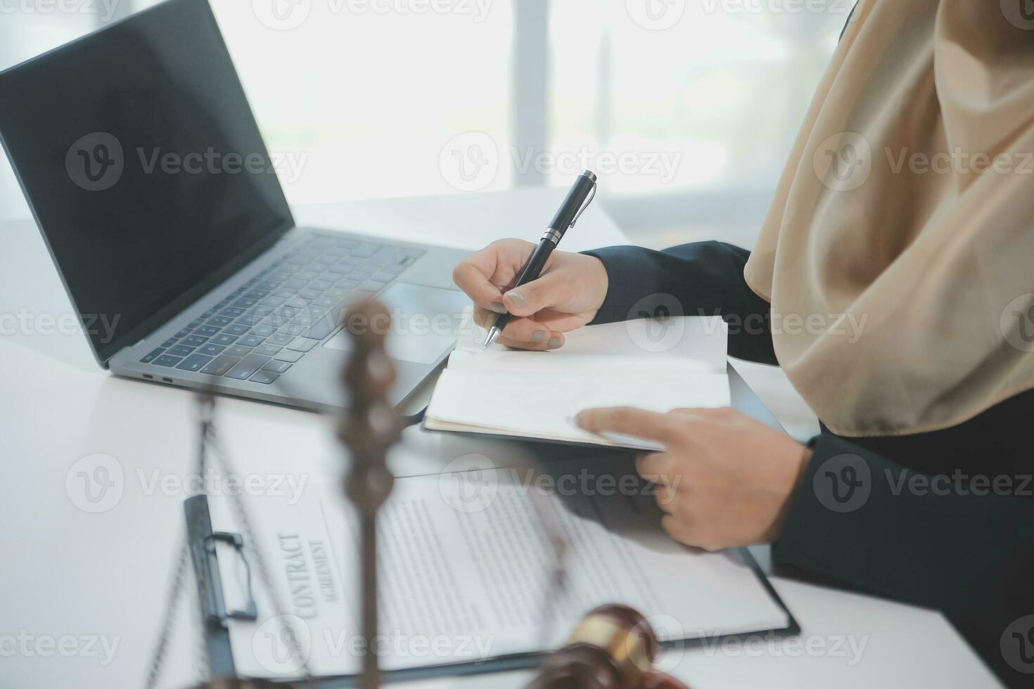 Business and lawyers discussing contract papers with brass scale on desk in office. Law, legal services, advice, justice and law concept picture with film grain effect photo