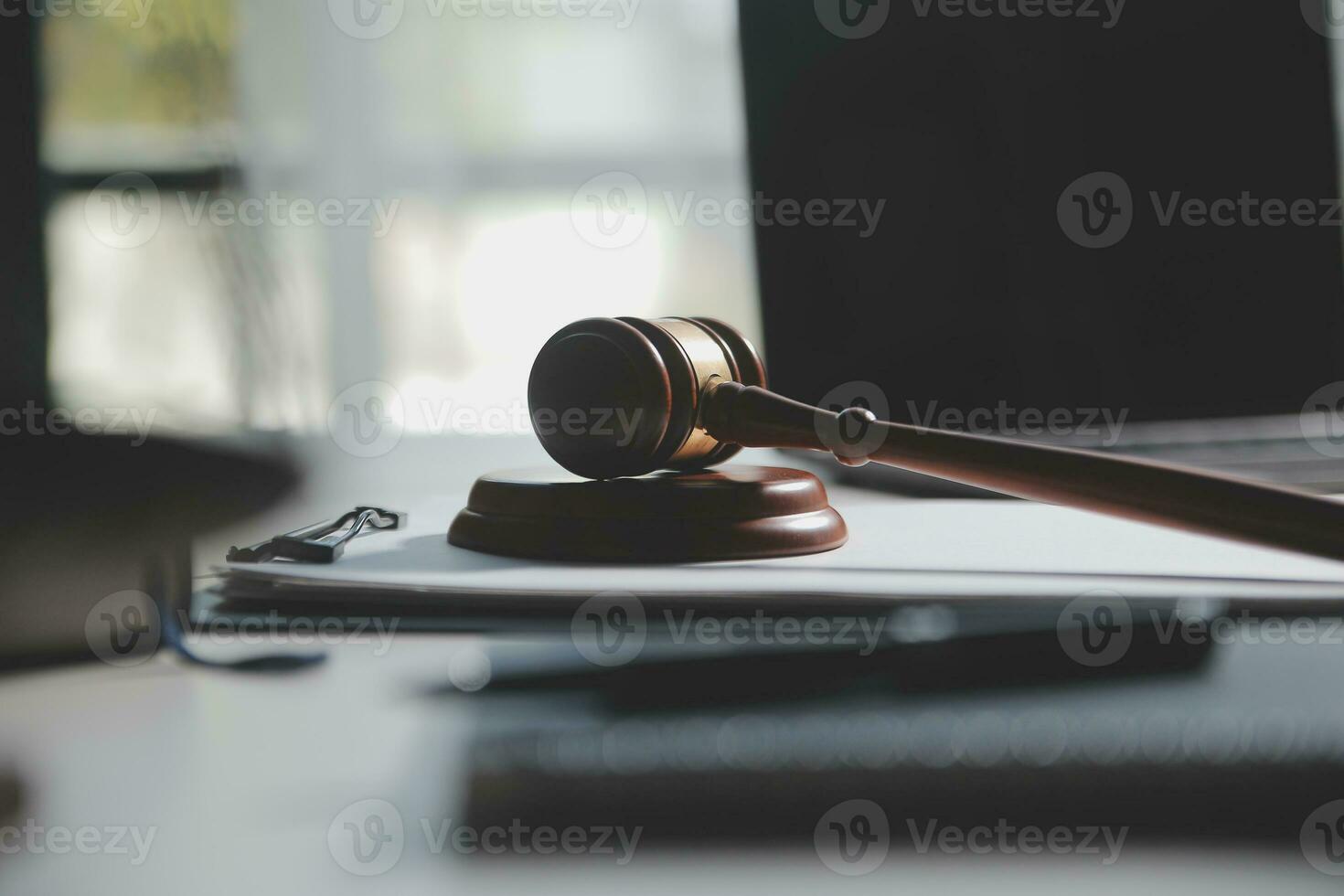 Business and lawyers discussing contract papers with brass scale on desk in office. Law, legal services, advice, justice and law concept picture with film grain effect photo