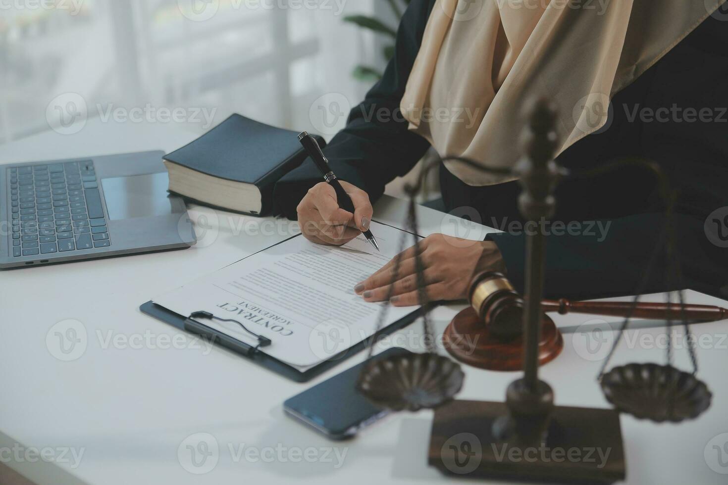 Business and lawyers discussing contract papers with brass scale on desk in office. Law, legal services, advice, justice and law concept picture with film grain effect photo