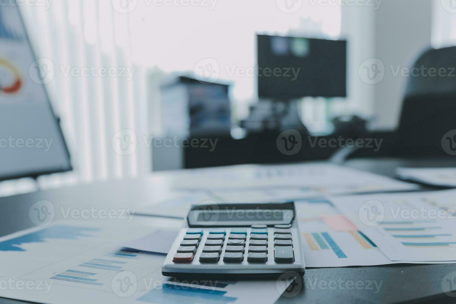 Shot of a asian young business Female working on laptop in her workstation. photo