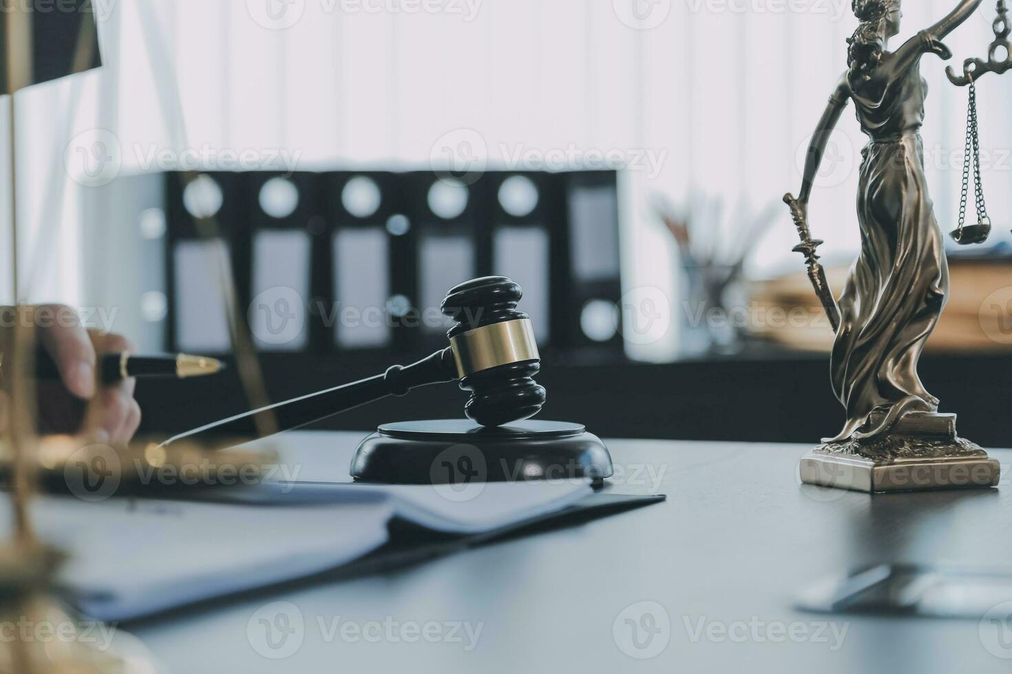 Business and lawyers discussing contract papers with brass scale on desk in office. Law, legal services, advice, justice and law concept picture with film grain effect photo