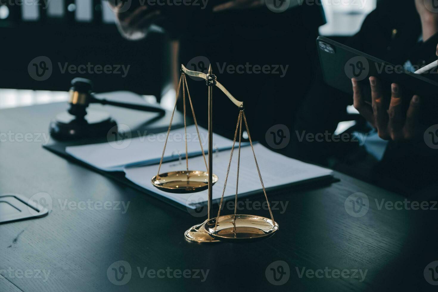 Business and lawyers discussing contract papers with brass scale on desk in office. Law, legal services, advice, justice and law concept picture with film grain effect photo
