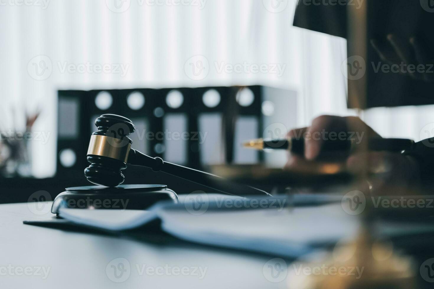 Business and lawyers discussing contract papers with brass scale on desk in office. Law, legal services, advice, justice and law concept picture with film grain effect photo