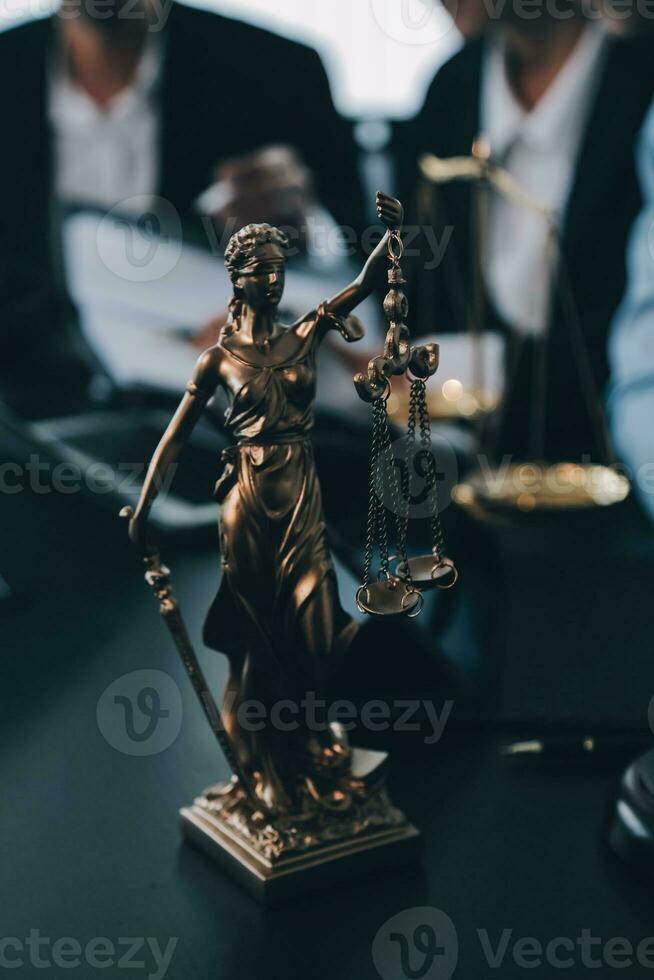 Business and lawyers discussing contract papers with brass scale on desk in office. Law, legal services, advice, justice and law concept picture with film grain effect photo