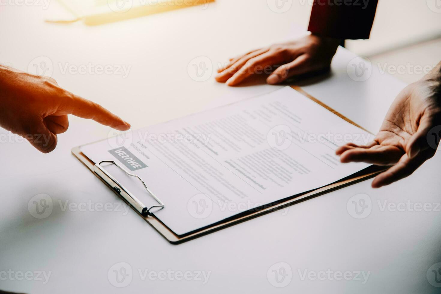 Close up view of job interview in office, focus on resume writing tips, employer reviewing good cv of prepared skilled applicant, recruiter considering application, hr manager making hiring decision photo