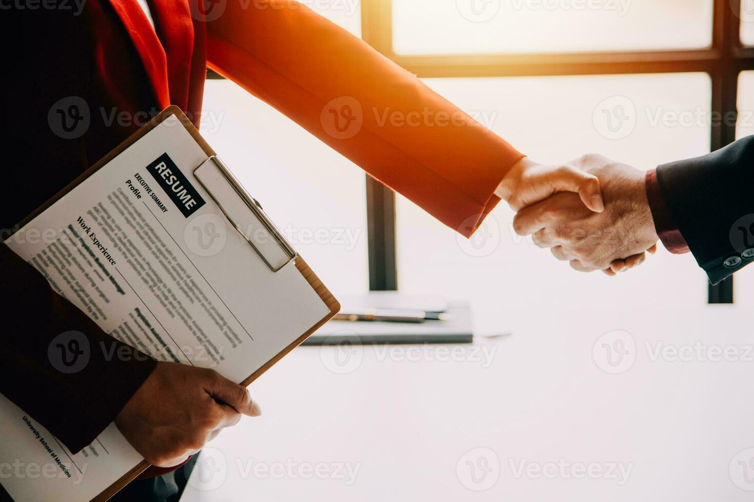 Close up view of job interview in office, focus on resume writing tips, employer reviewing good cv of prepared skilled applicant, recruiter considering application, hr manager making hiring decision photo