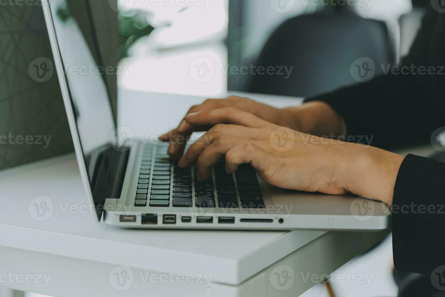 Close up of Business team analyzing income charts and graphs with modern laptop computer. Business analysis and strategy concept. photo