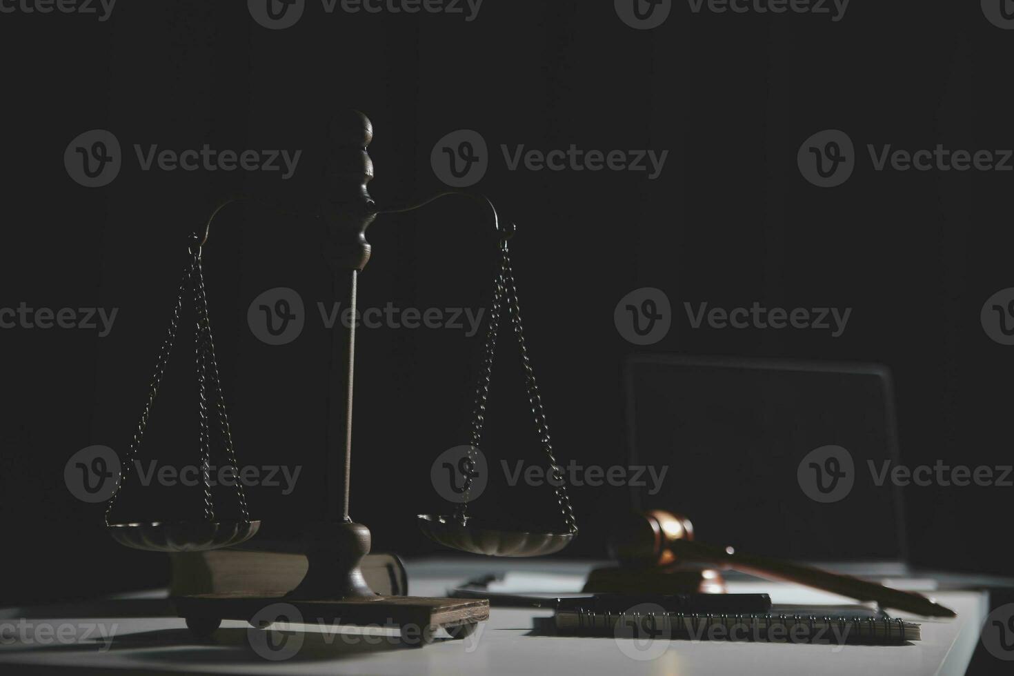 Business and lawyers discussing contract papers with brass scale on desk in office. Law, legal services, advice, justice and law concept picture with film grain effect photo