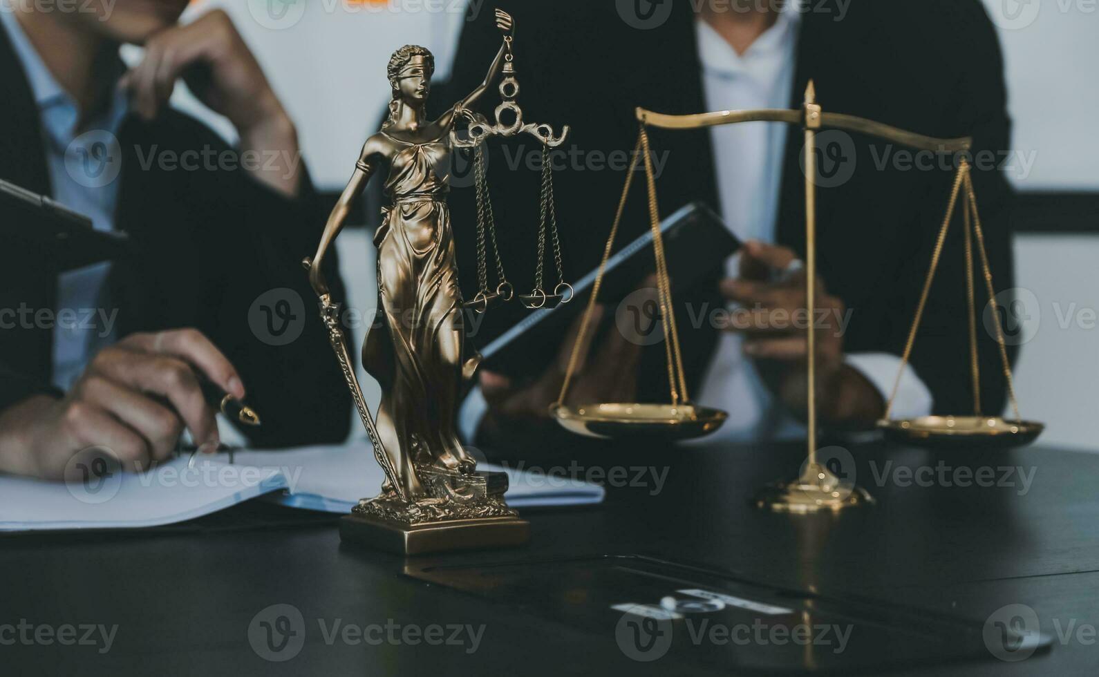Business and lawyers discussing contract papers with brass scale on desk in office. Law, legal services, advice, justice and law concept picture with film grain effect photo