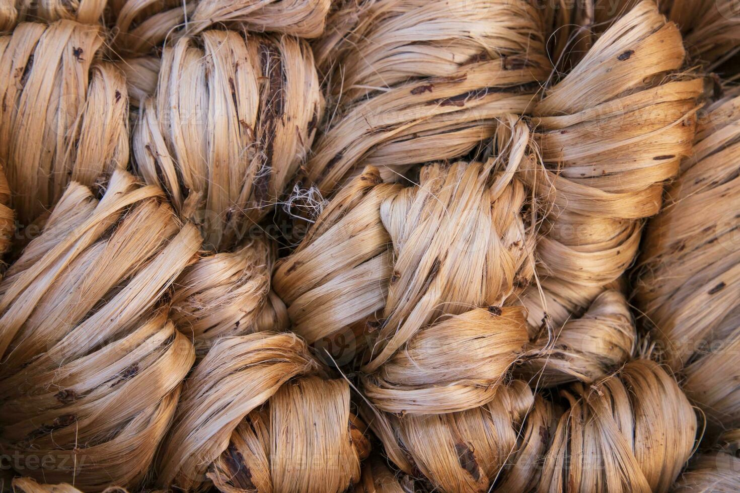 Thick Golden bundle of raw jute fiber abstract Pattern Texture Can be used as a Background wallpaper photo