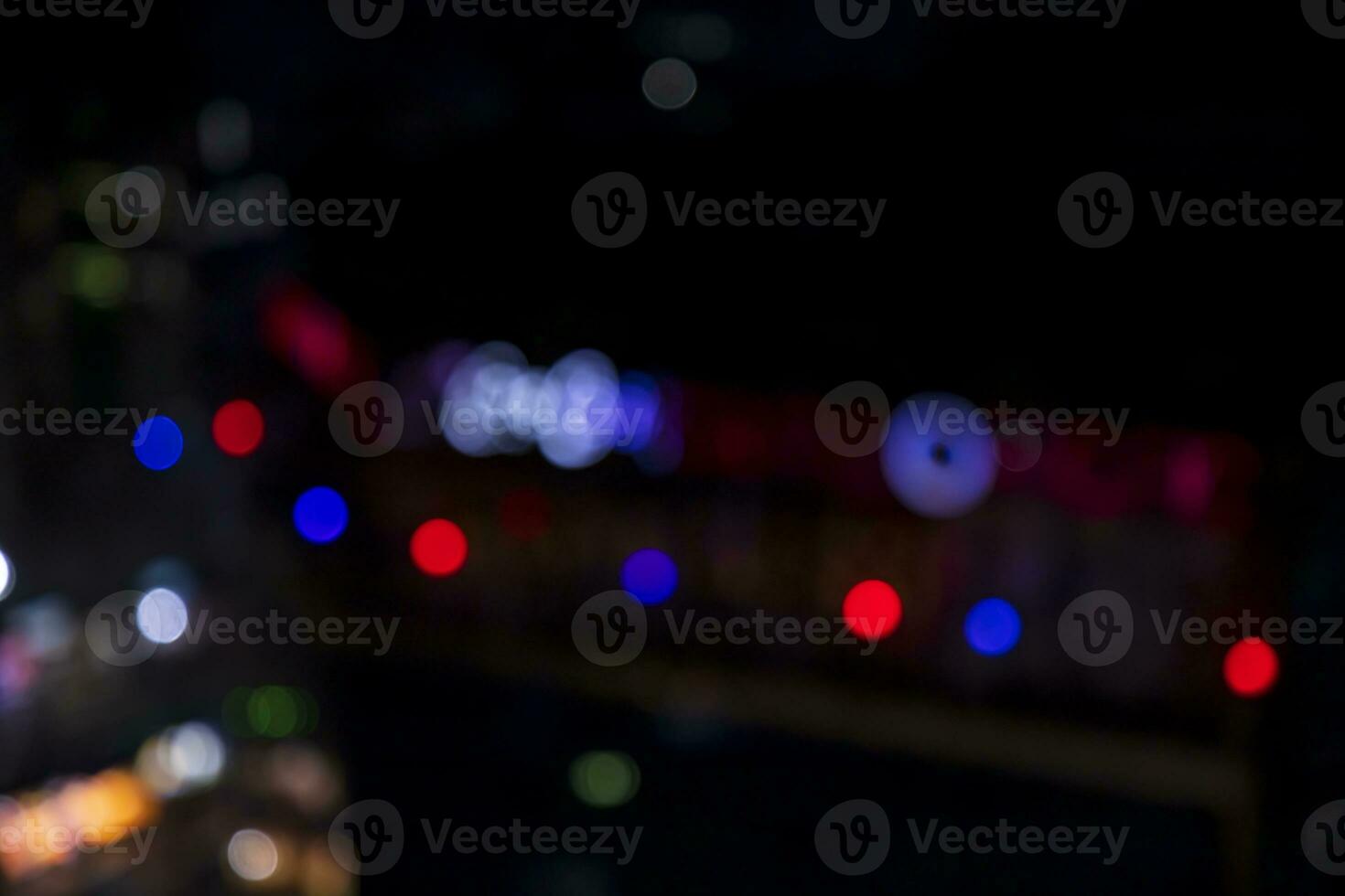 Night city street abstract blurry bokeh lights background photo