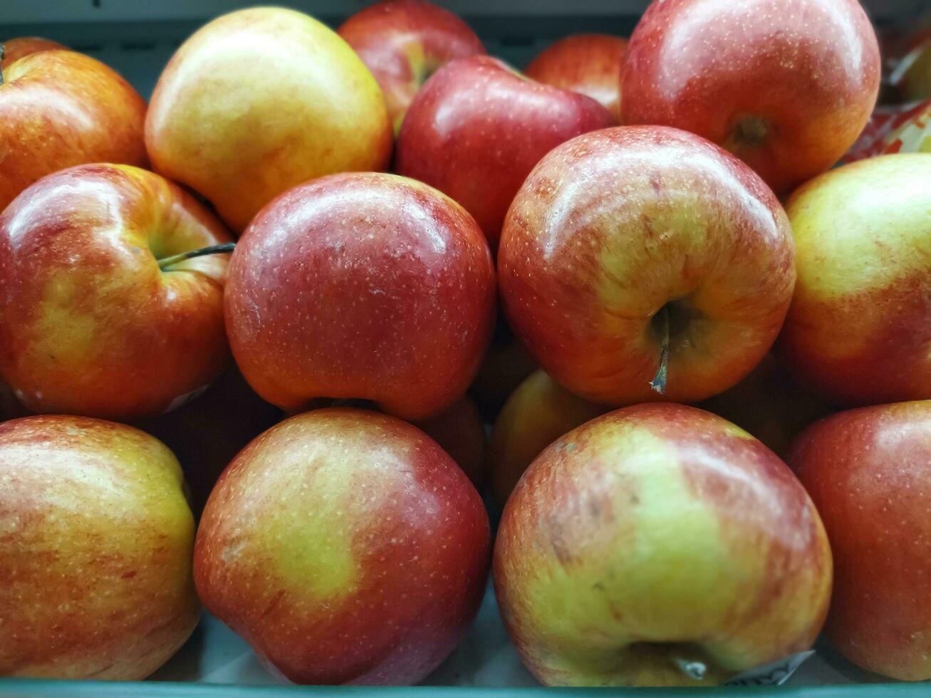 A lot of apples spread all over the screen. Food background. photo