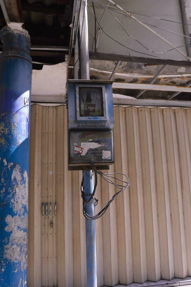 box where the electric current meter is placed on the electricity pole photo