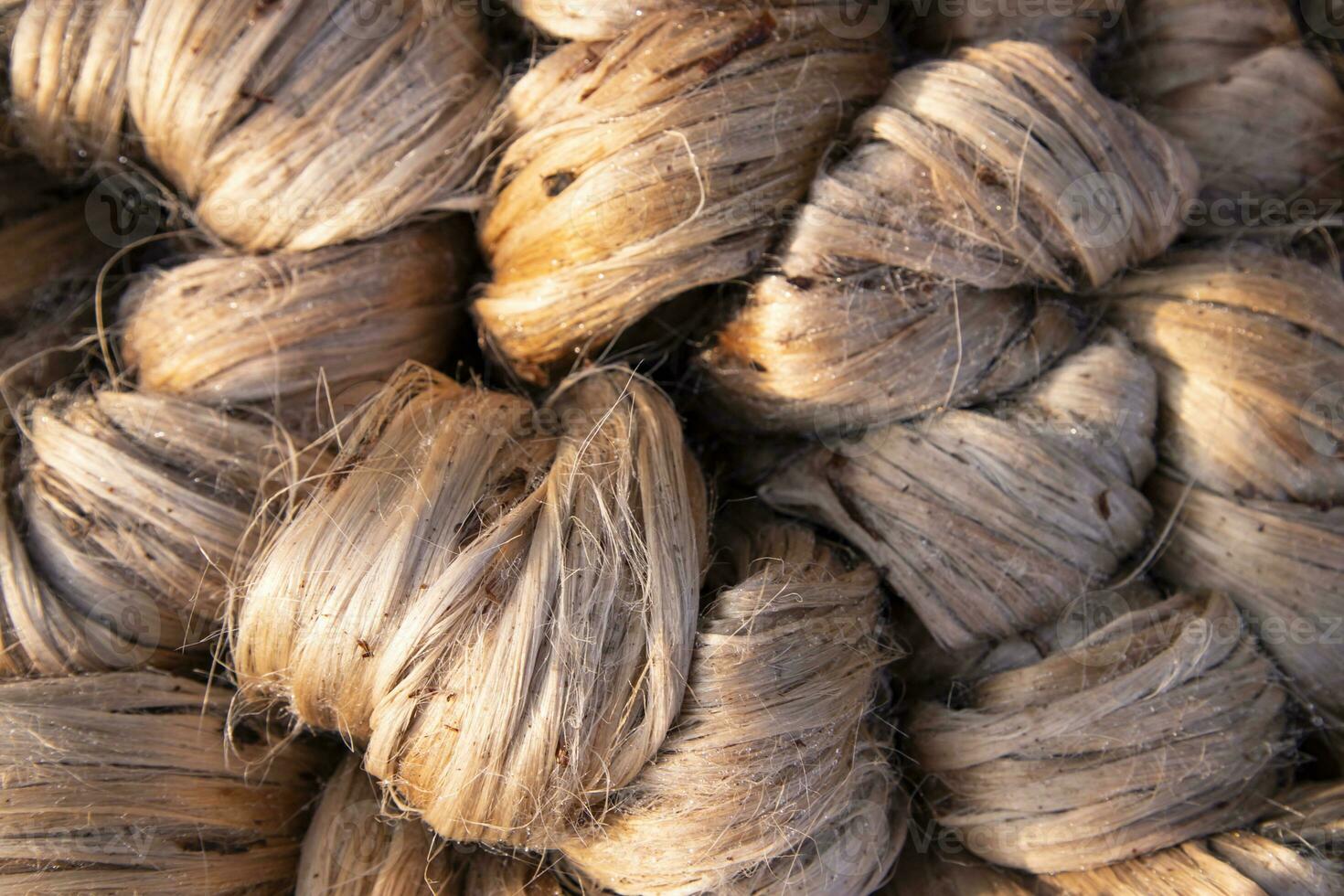 Thick Golden bundle of raw jute fiber Pattern Texture Can be used as a Background wallpaper. This is the Called Golden Fiber in Bangladesh photo