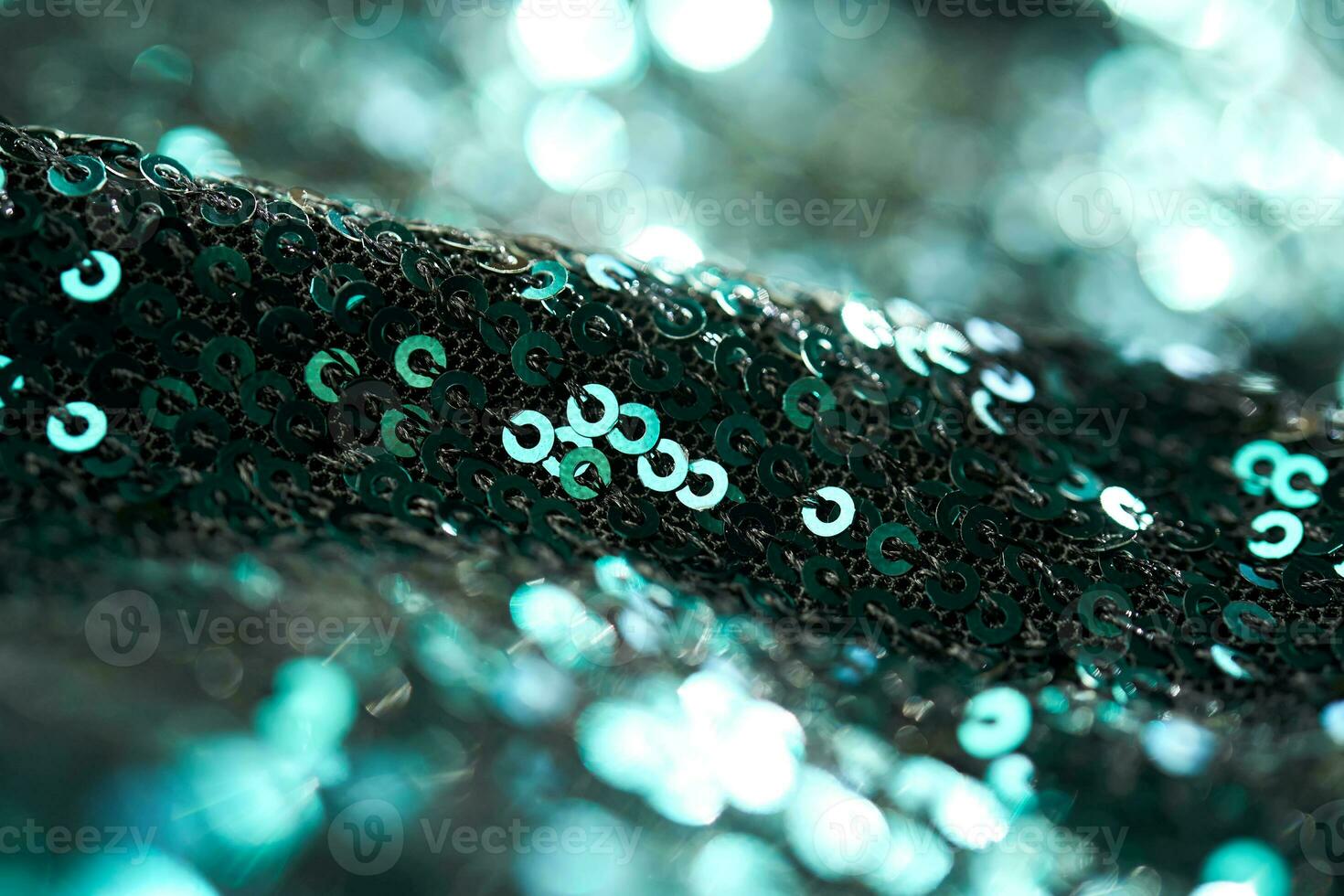 Christmas abstract background made of emerald green sequins. photo