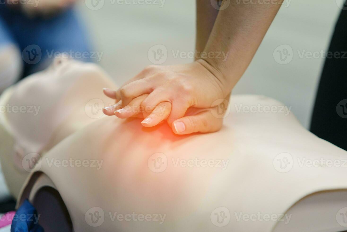 CPR First Aid Training with CPR dummy in the class photo