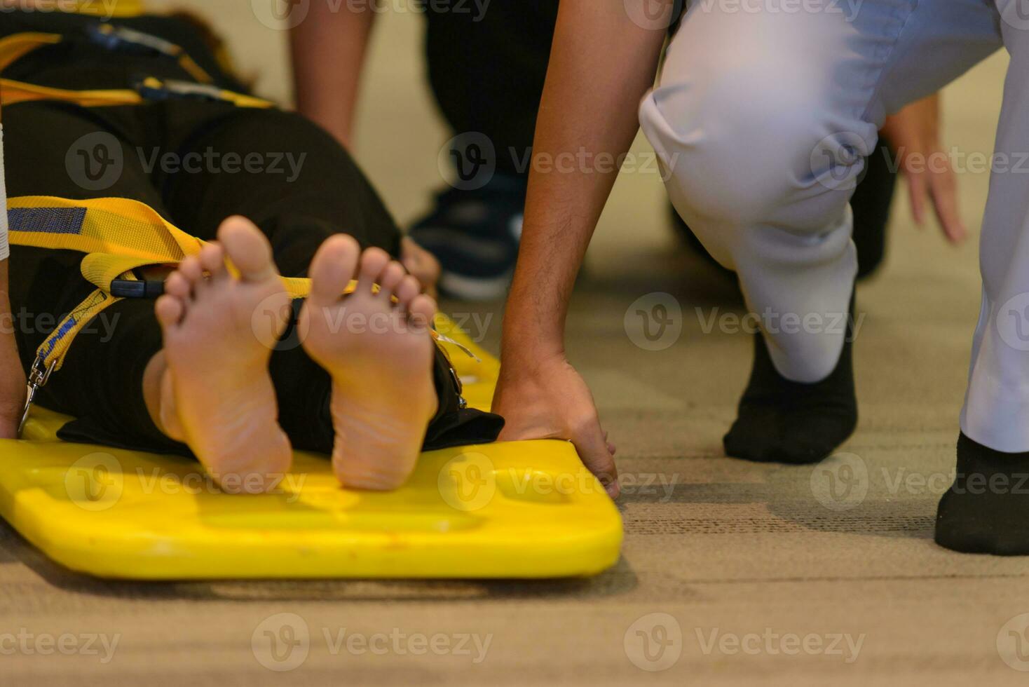 first aid training about moving patient by stretcher photo