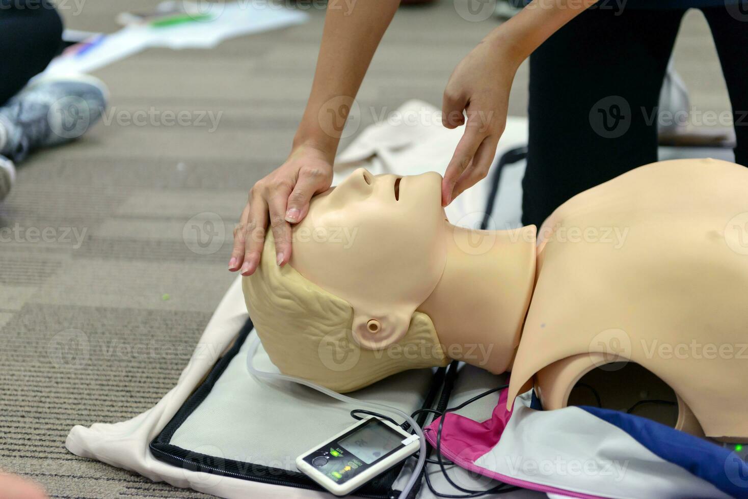 CPR First Aid Training with CPR dummy in the class photo